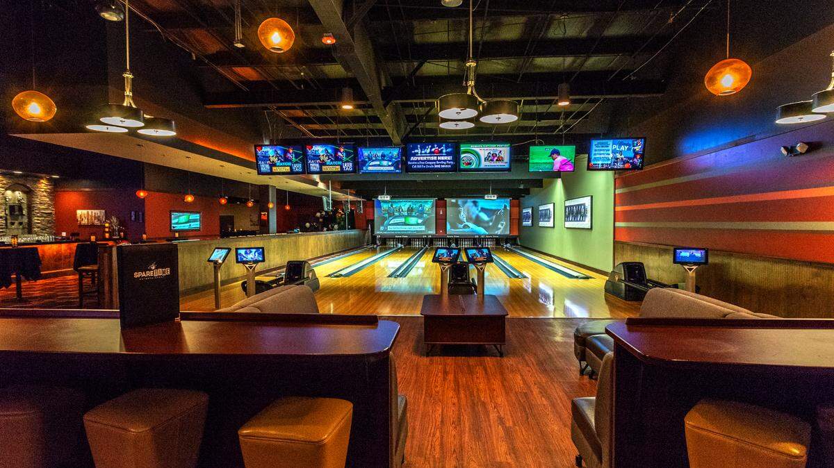 Similar to the Spare Time Entertainment Huntersville location seen here, the new Pineville venue will include a VIP suite with six bowling lanes, couches and a private bar when it opens in August.