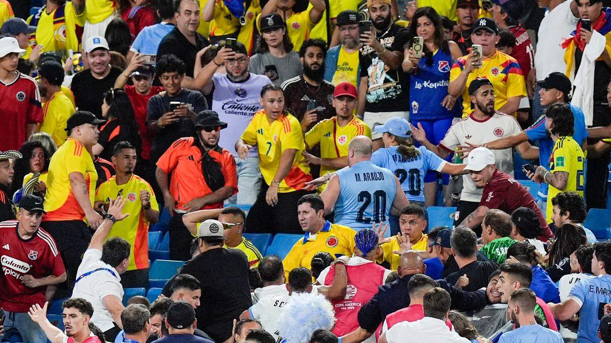 Colombian fans get into an altercation with Uruguayan players and staff after Wednesday’s Copa Armerica semifinal match at Bank of America Stadium in Charlotte.