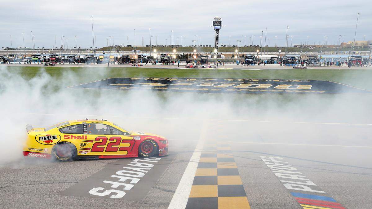 KANSAS CITY, KANSAS - OCTOBER 18: Joey Logano, driver of the #22 Shell Pennzoil Ford, celebrates with a burnout after winning the NASCAR Cup Series Hollywood Casino 400 at Kansas Speedway on October 18, 2020 in Kansas City, Kansas. (Photo by Jamie Squire/Getty Images)