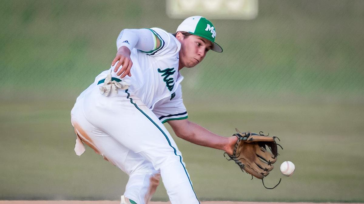 Myers Park’s short stop Patrick Alvarez (center) stops the line drive and throws out the runner at 1st base.