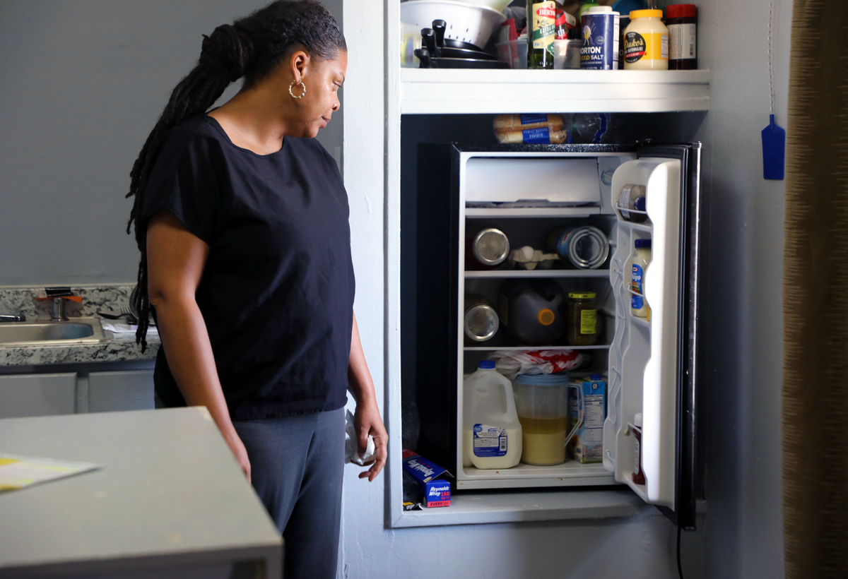 Alicia Harvey stands in her kitchen at the Lamplighter Inn in Charlotte.