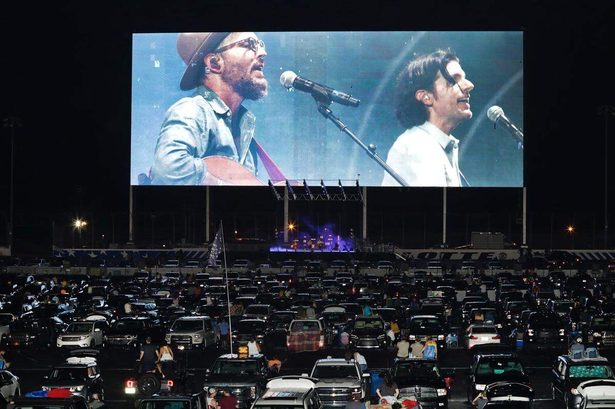 The Avett Brothers perform at Charlotte Motor Speedway in a drive-in-style setting on Saturday night.