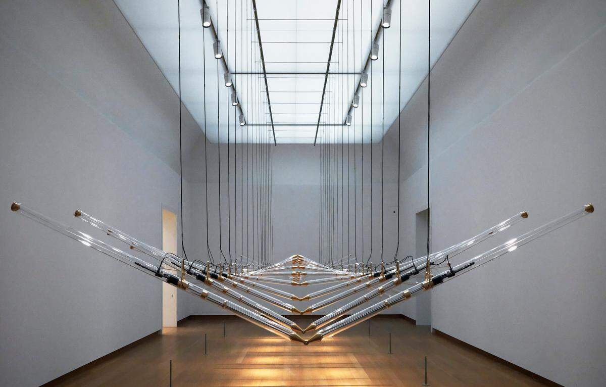 This piece, called “Amplitude,” is one of five Studio Drift pieces included in the “Immersed in Light” exhibition at the Mint Museum Uptown. All five works by the Dutch studio explore connections between humans, nature and technology.