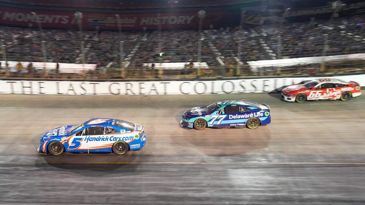 Sep 21, 2024; Bristol, Tennessee, USA; NASCAR Cup Series driver Kyle Larson (5), driver Carson Hocevar (77) and driver Josh Bilicki (66) during the Bass Pro Shops Night Race at Bristol Motor Speedway.