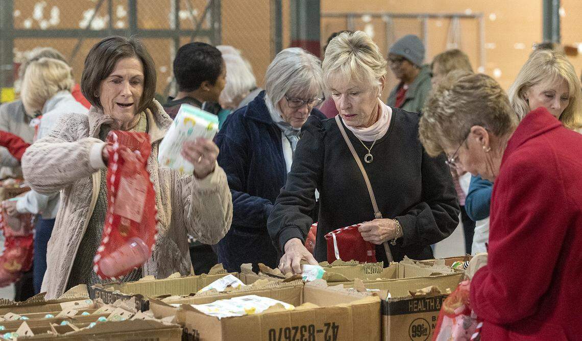 About 40 members of the Salvation Army’s Women’s Auxiliary group stuffed stockings with toys and other items for their Angel Tree program. 