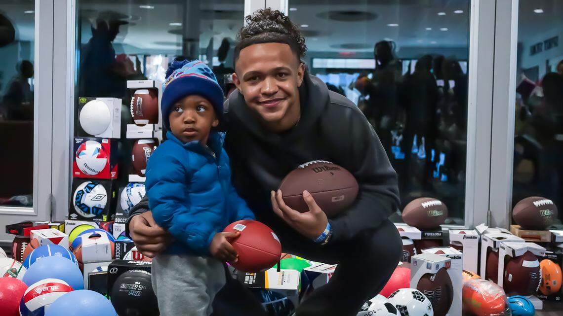 Jadyn Davis’ Christmas. Michigan QB, former local star, uses NIL to help needy families