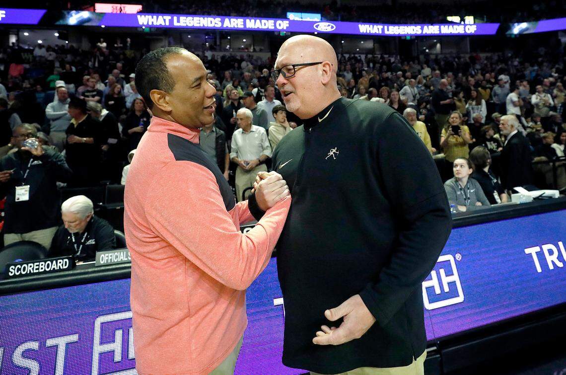 N.C. State head coach Kevin Keatts and Wake Forest head coach Steve Forbes greet each other prior to their teams’ game on Saturday, Feb. 10, 2024, at Lawrence Joel Veterans Memorial Coliseum in Winston-Salem, N.C.