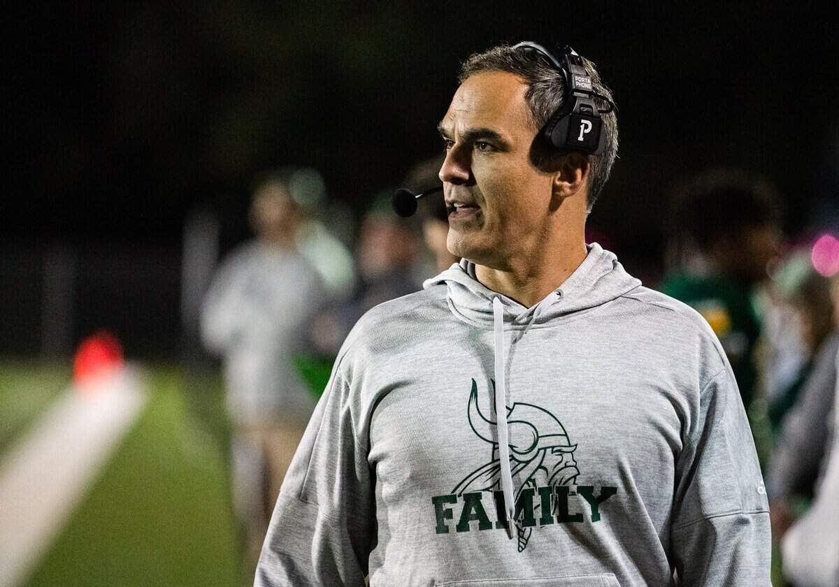 Central Cabarrus head coach Kenneth McClamrock looks on as his team trys to convert a 3rd down and long.