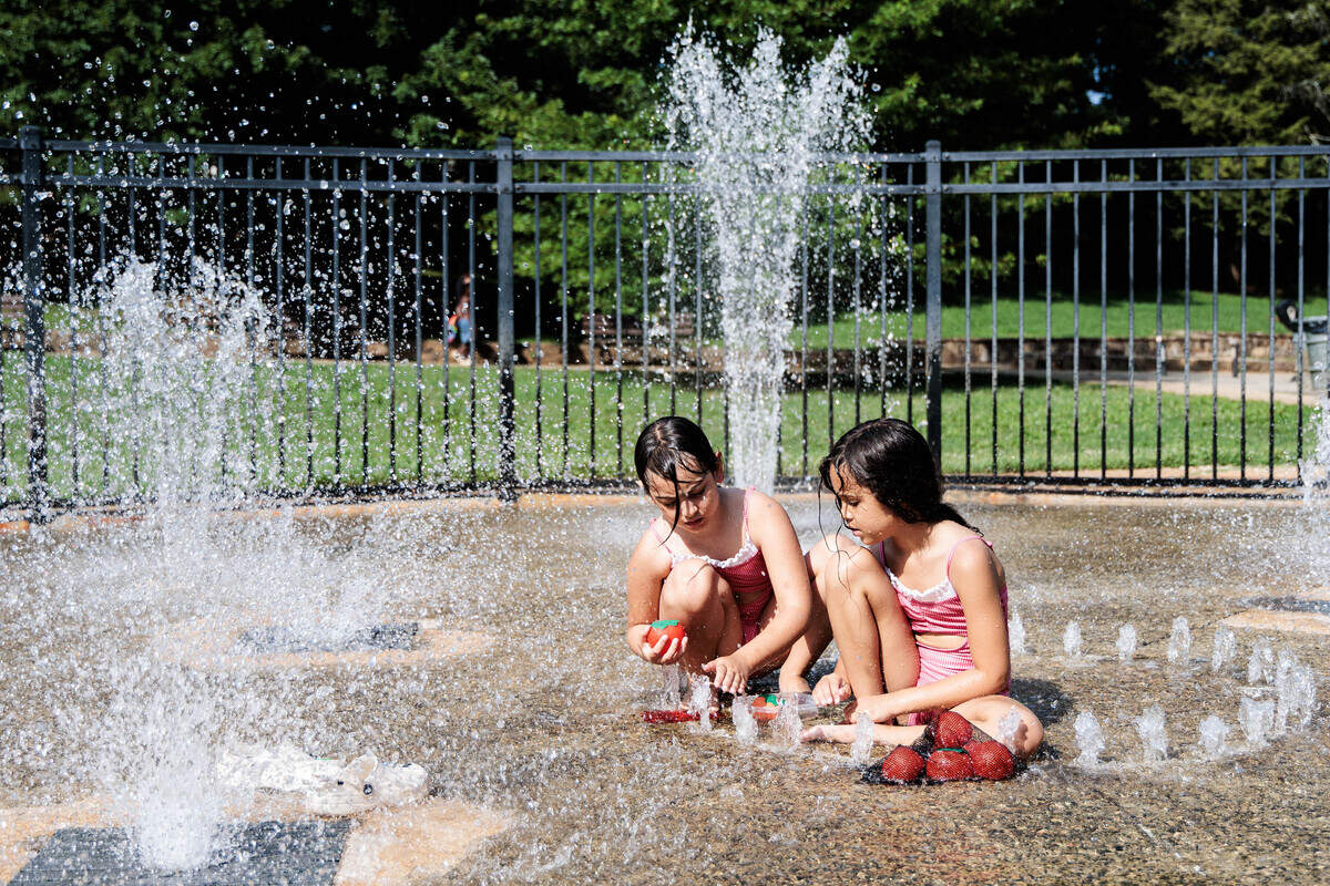 With hot pavement and playground equipment, children should hydrate and play in shaded areas if available.