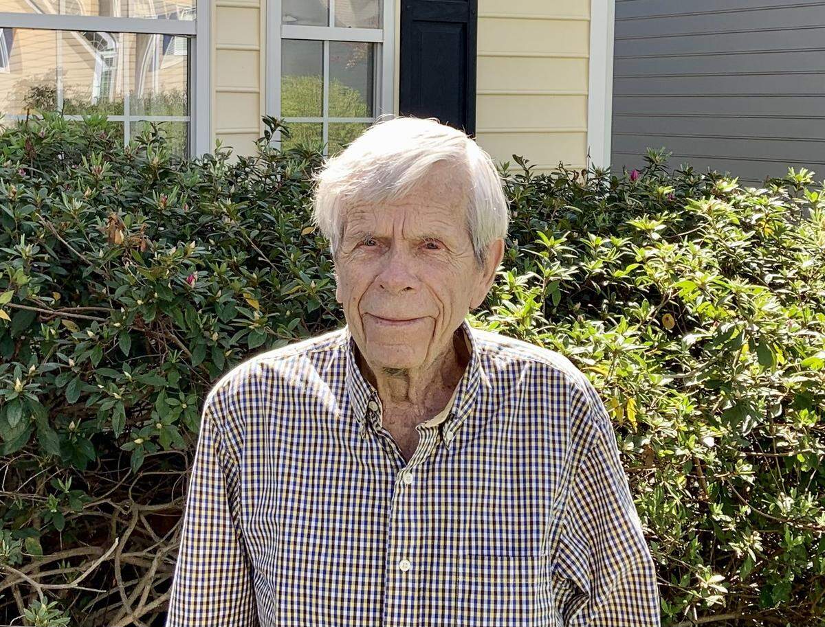 Former Charlotte Observer columnist Ron Green stands in front of his home in south Charlotte on March 30, 2021, shortly after he turned 92 years old. Green covered 60 consecutive Masters golf tournaments for Charlotte newspapers.