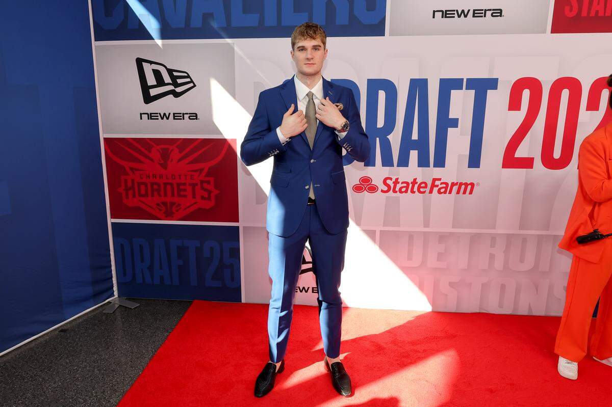 Liam McNeeley arrives before the first round of the 2025 NBA Draft at Barclays Center.