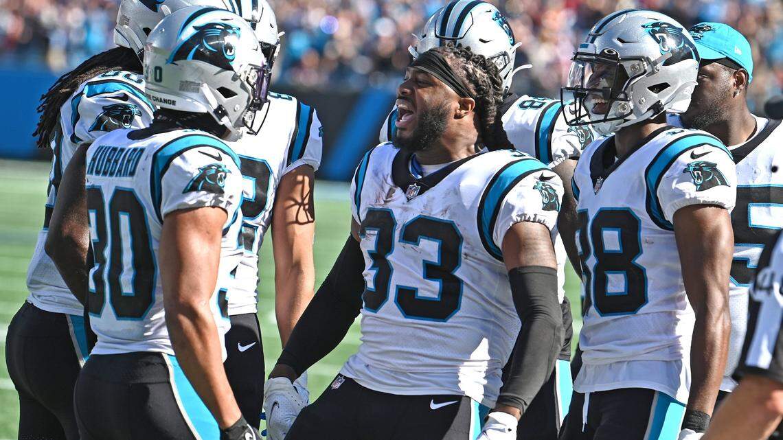 Carolina Panthers running back D’Onta Foreman, center, runs to celebrate running back Chuba Hubbard’s, left, rushing touchdown during second half action against the Tampa Bay Buccaneers at Bank of America Stadium in Charlotte, NC on Sunday, October 23, 2022. The Panthers defeated the Buccaneers 21-3.