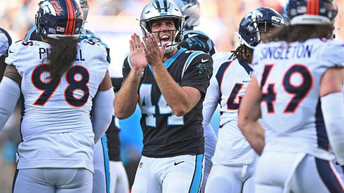 Carolina Panthers long snapper JJ Jansen, center, celebrates a field goal by kicker Eddy Pineiro during second half action against the Denver Broncos on Sunday, November 27, 2022 at Bank of America Stadium in Charlotte, NC. Jansen tied former kicker John Kasey for most games played at 221 in franchise history.