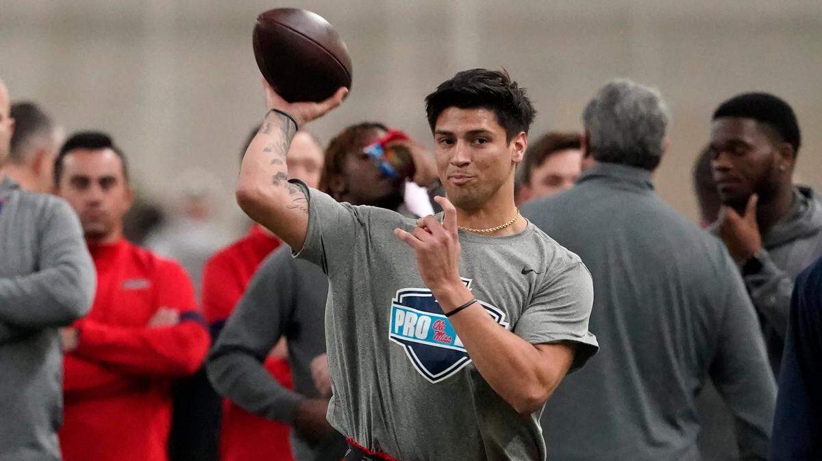 Quarterback Matt Corral passes during a drill at the Mississippi football pro day in Oxford, Miss., Wednesday, March 23, 2022. (AP Photo/Rogelio V. Solis)