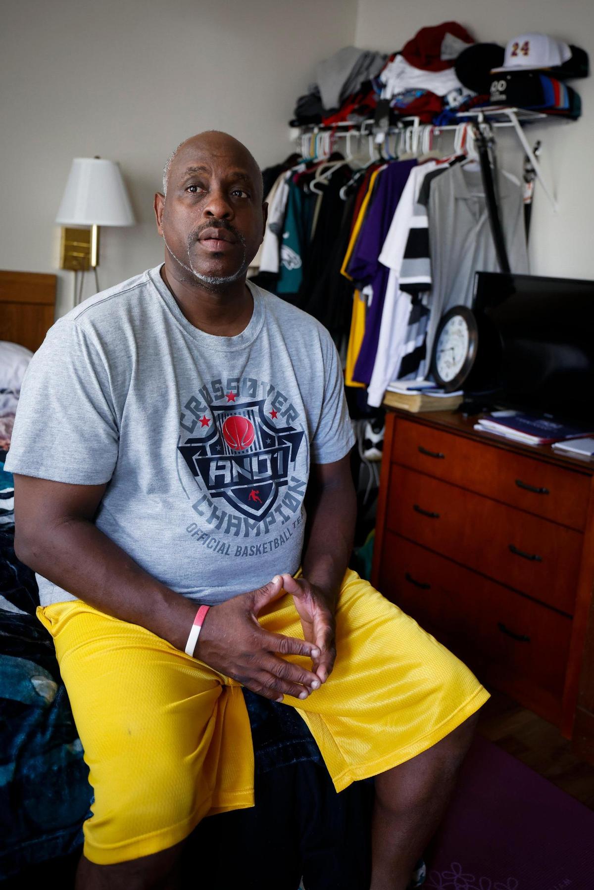 Rory Pegram sits on his bed in the Stay Lodge extended stay hotel in Charlotte. Pegram says he cannot afford to own a home on his salary of $18.31 an hour.