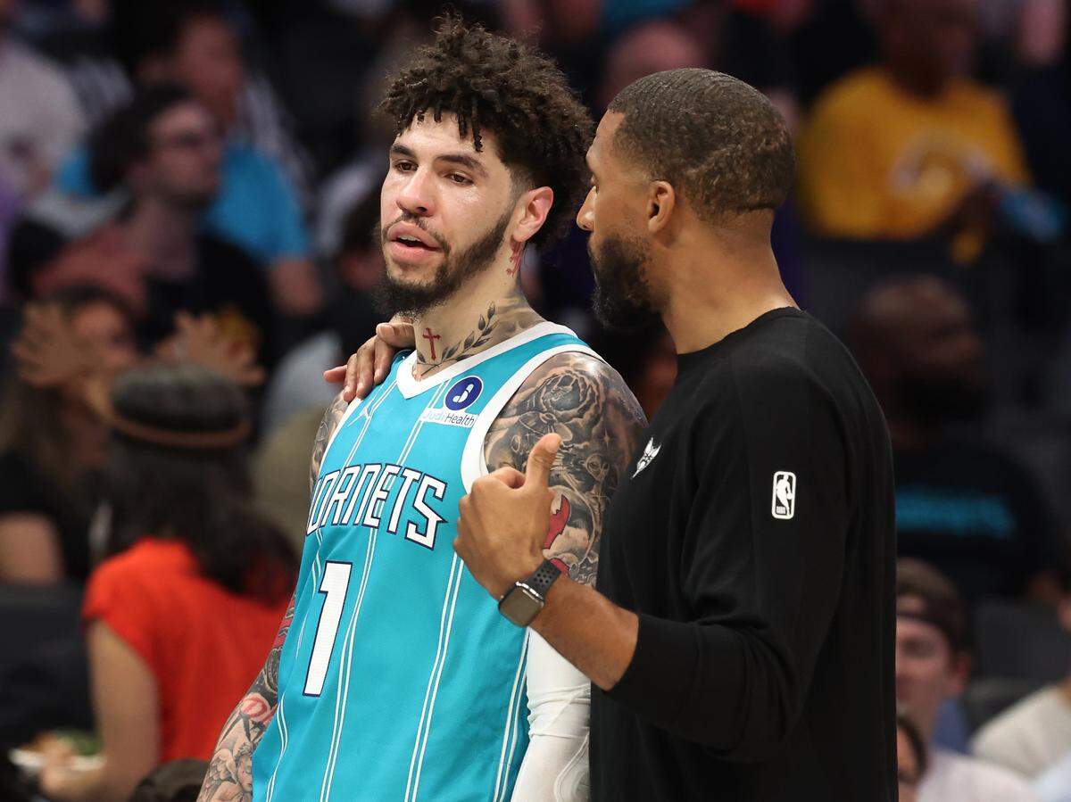 Charlotte Hornets head coach Charles Lee speaks with guard LaMelo Ball during action against the Phoenix Suns at Spectrum Center in Charlotte, North Carolina, on Thursday, April 2, 2026.