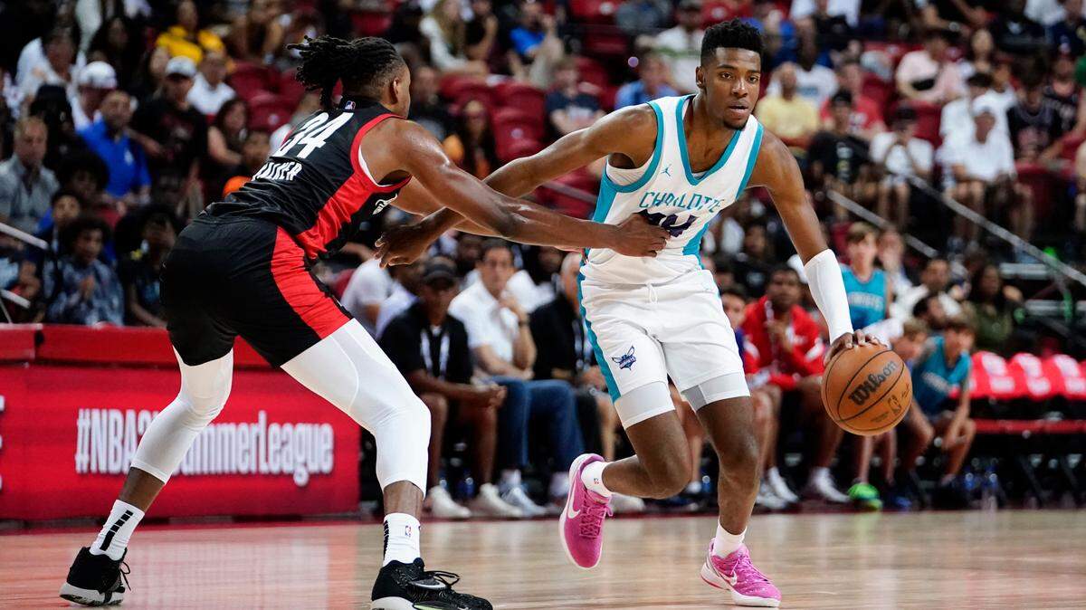 Charlotte Hornets forward Brandon Miller (24) dribbles the ball against Portland Trail Blazers forward Jabari Walker (34) during the second half of Tuesday’s game at Thomas & Mack Center in Las Vegas. (Lucas Peltier-USA TODAY Sports)