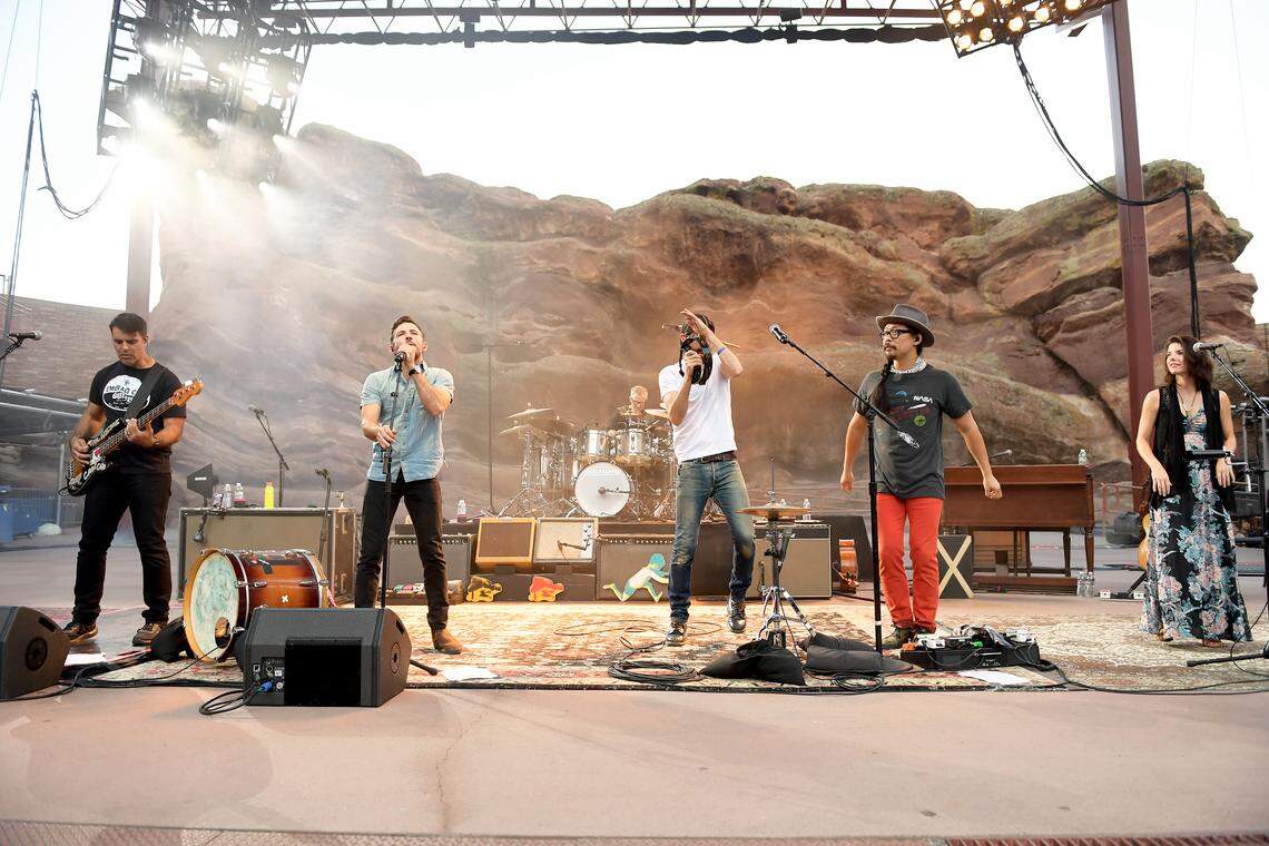 Bob Crawford, far left, with other members of The Avett Brothers performing at Red Rocks Amphitheatre in 2018 in Morrison, Colorado. Crawford’s first book, a John Quincy Adams biography, publishes March 10.