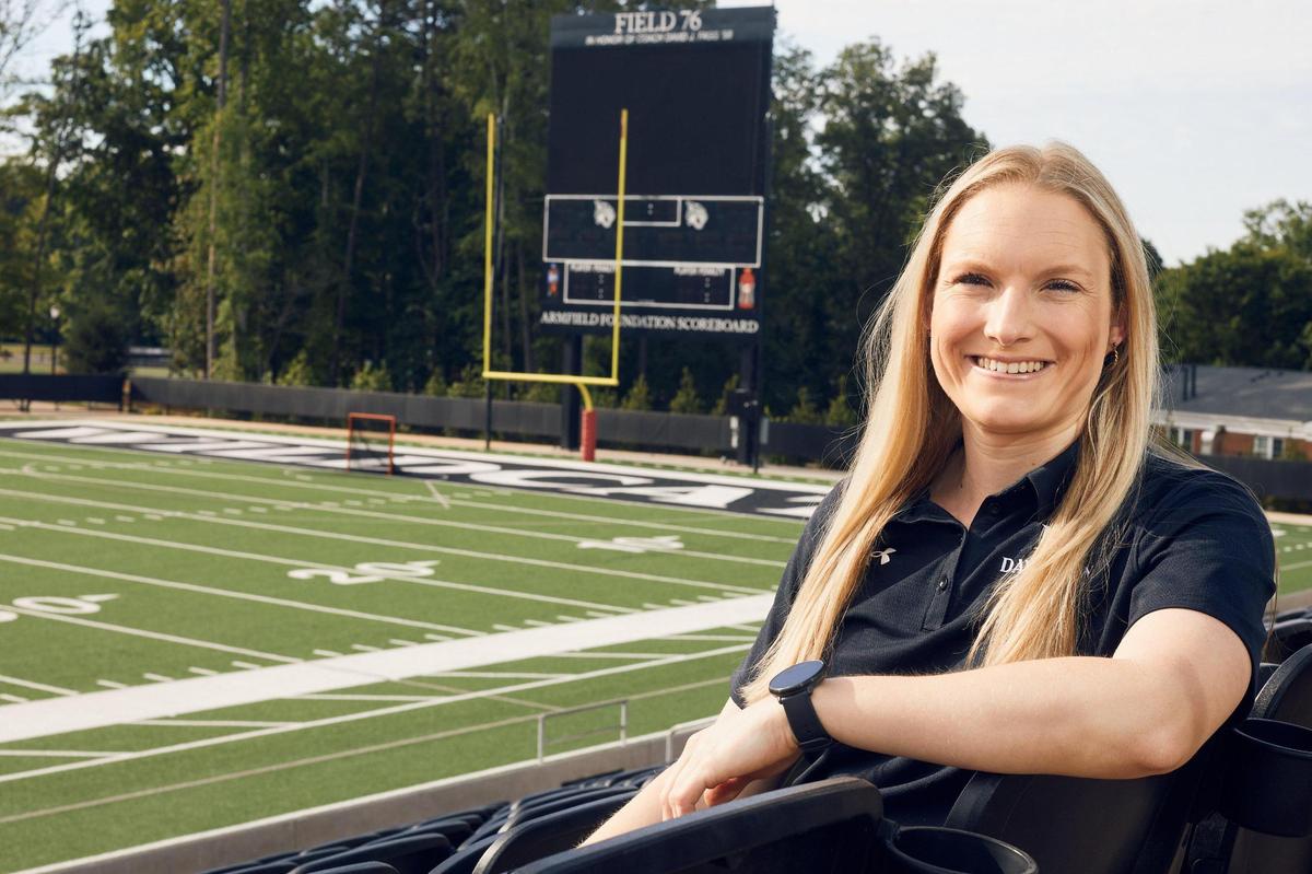 Madison See, the director of mental health for athletics at Davidson, in the stands of Davidson College Stadium.