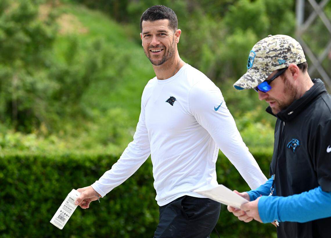 Carolina Panthers head coach Dave Canales smiles as he walks to the team’s voluntary minicamp practice on Wednesday, April 24, 2024.