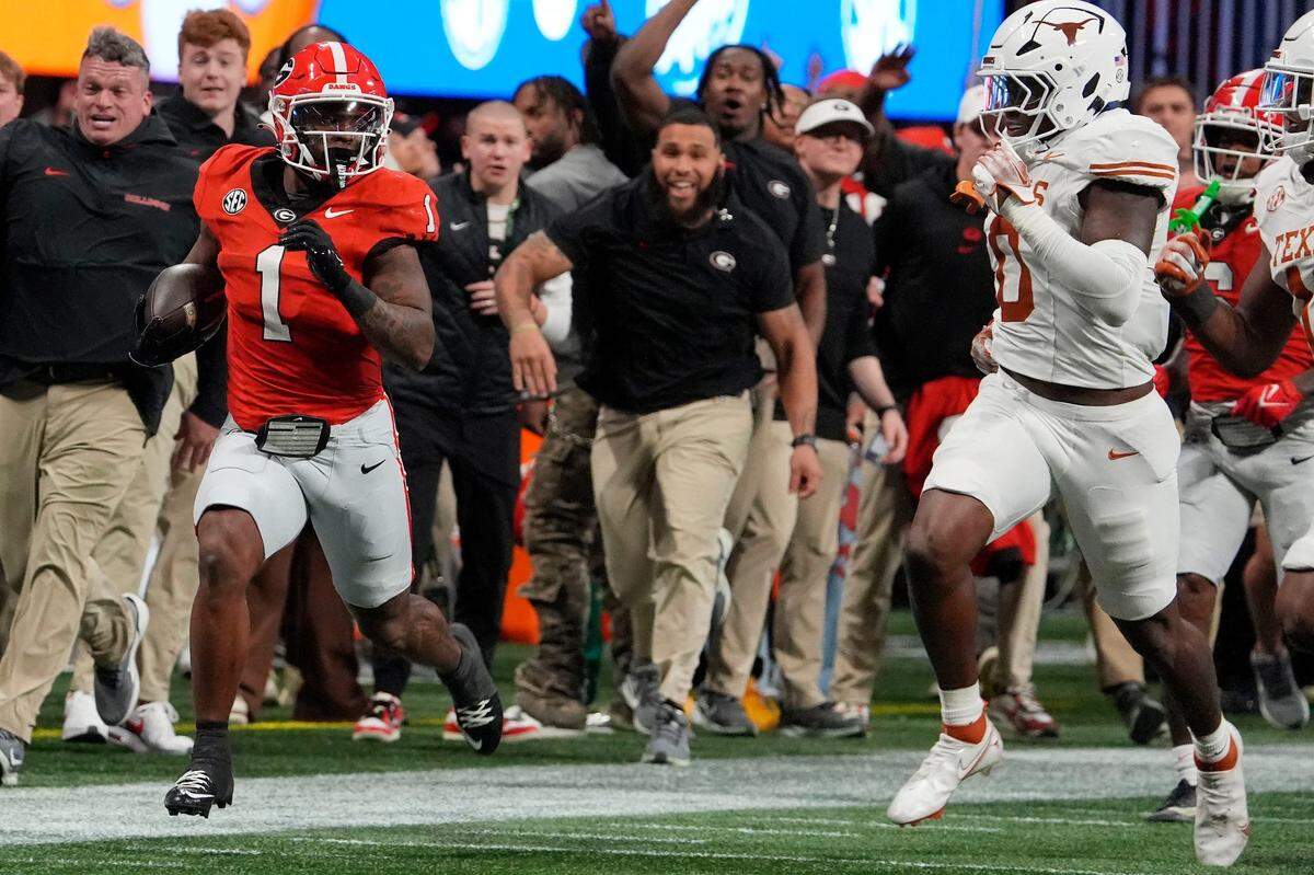 Georgia running back Trevor Etienne (1) breaks away for a big gain during the second half of the SEC championship game against Texas in Atlanta, on Saturday, Dec. 7, 2024.