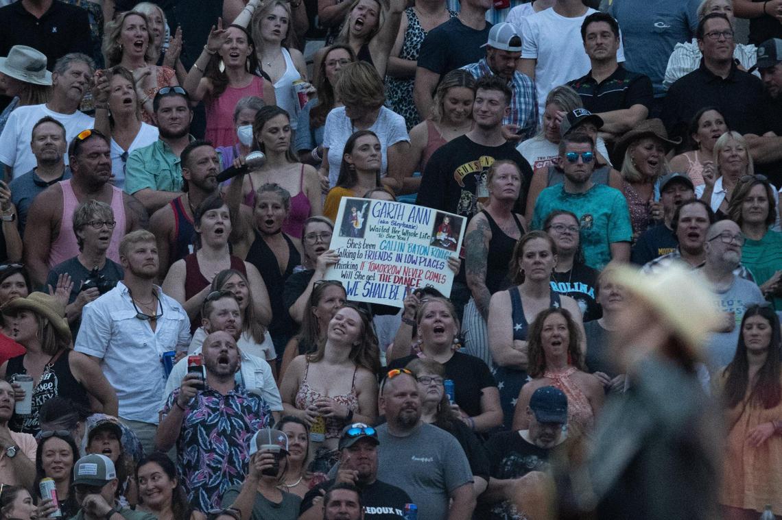 Fans of Garth Brooks react as he performs live before a packed lower-bowl crowd at the Bank of America Stadium Friday, July 15, 2022.
