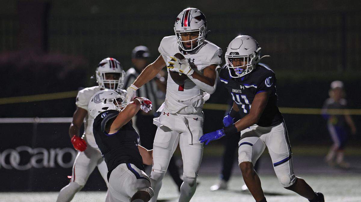 Providence Day wide receiver Channing Goodwin, center, scores a touchdown against Charlotte Christian on Friday, October 13, 2023.