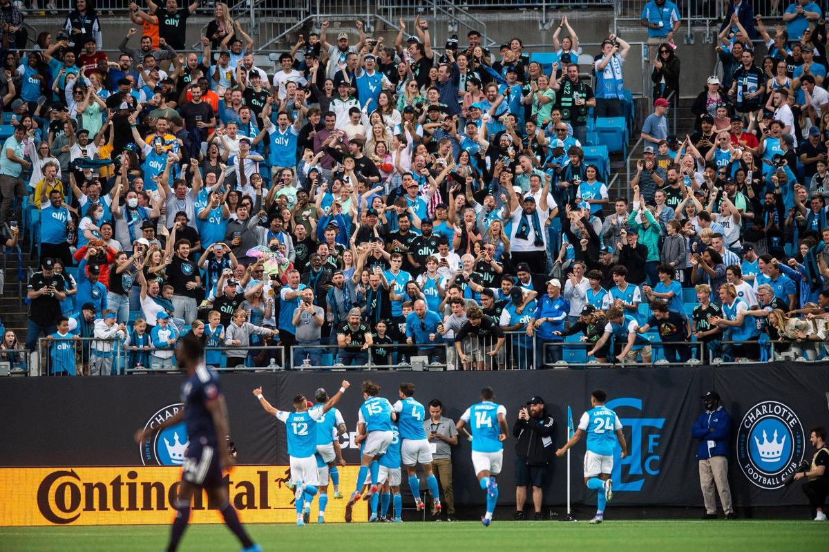 Fans celebrate after a goal by Charlotte FC during the game against the New England Revolution at Bank of America Stadium on Saturday, March 19, 2022 in Charlotte, NC. Charlotte FC defeated the Revolution, 3-1, for their first win of the season.