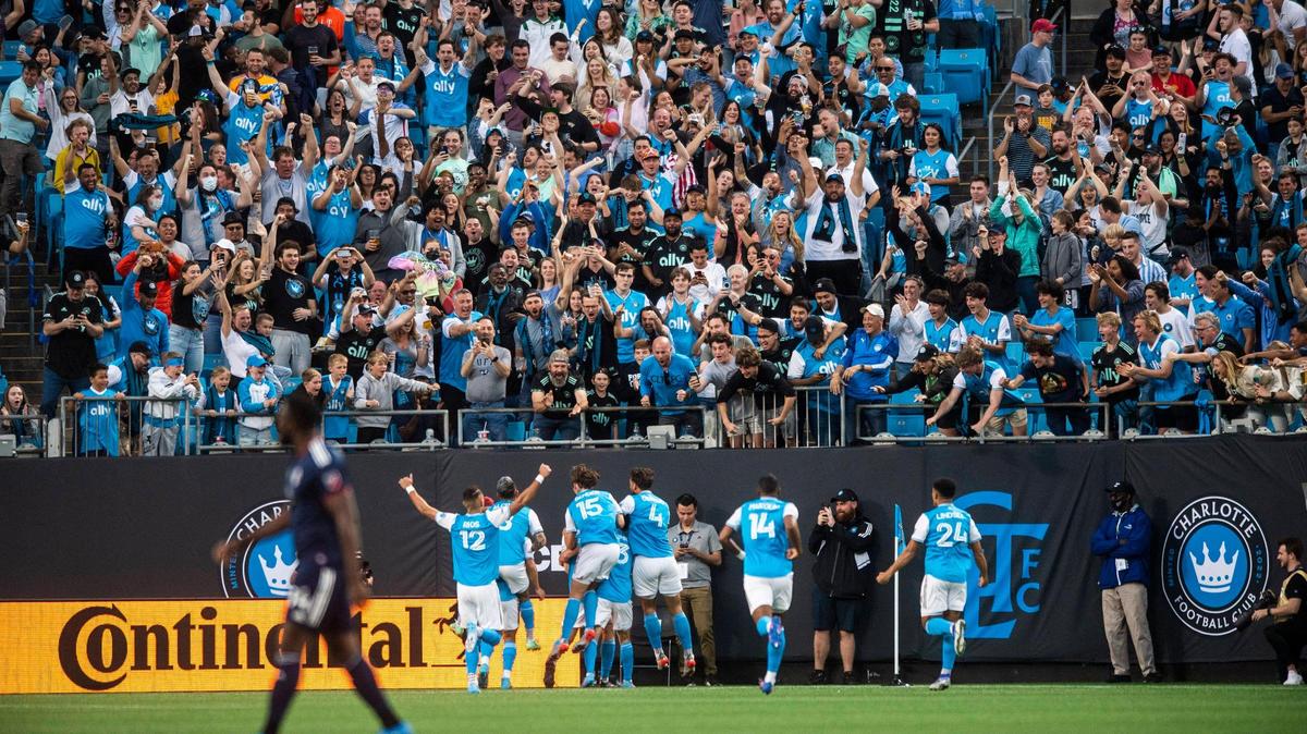 Fans celebrate after a goal by Charlotte FC during the game against the New England Revolution at Bank of America Stadium on Saturday, March 19, 2022 in Charlotte, NC. Charlotte FC defeated the Revolution, 3-1, for their first win of the season.