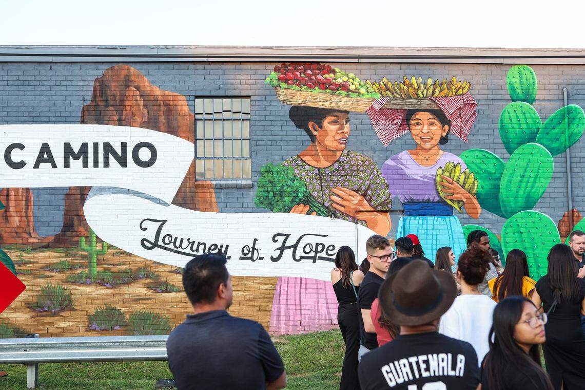 People view the murals on the back of Camino, a bilingual nonprofit, as they celebrate the beginning of Hispanic Heritage Month in September 2022 in Charlotte.