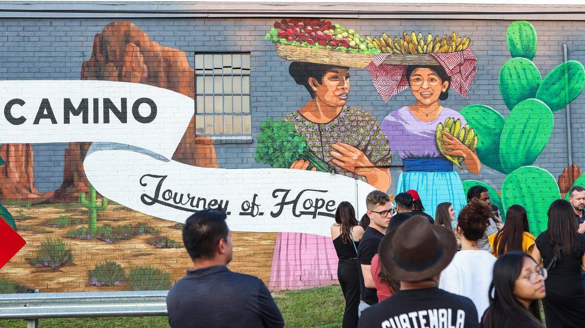 People view the murals on the back of Camino, a bilingual nonprofit, as they celebrate the beginning of Hispanic Heritage Month on Thursday, September 15, 2022 in Charlotte, NC.