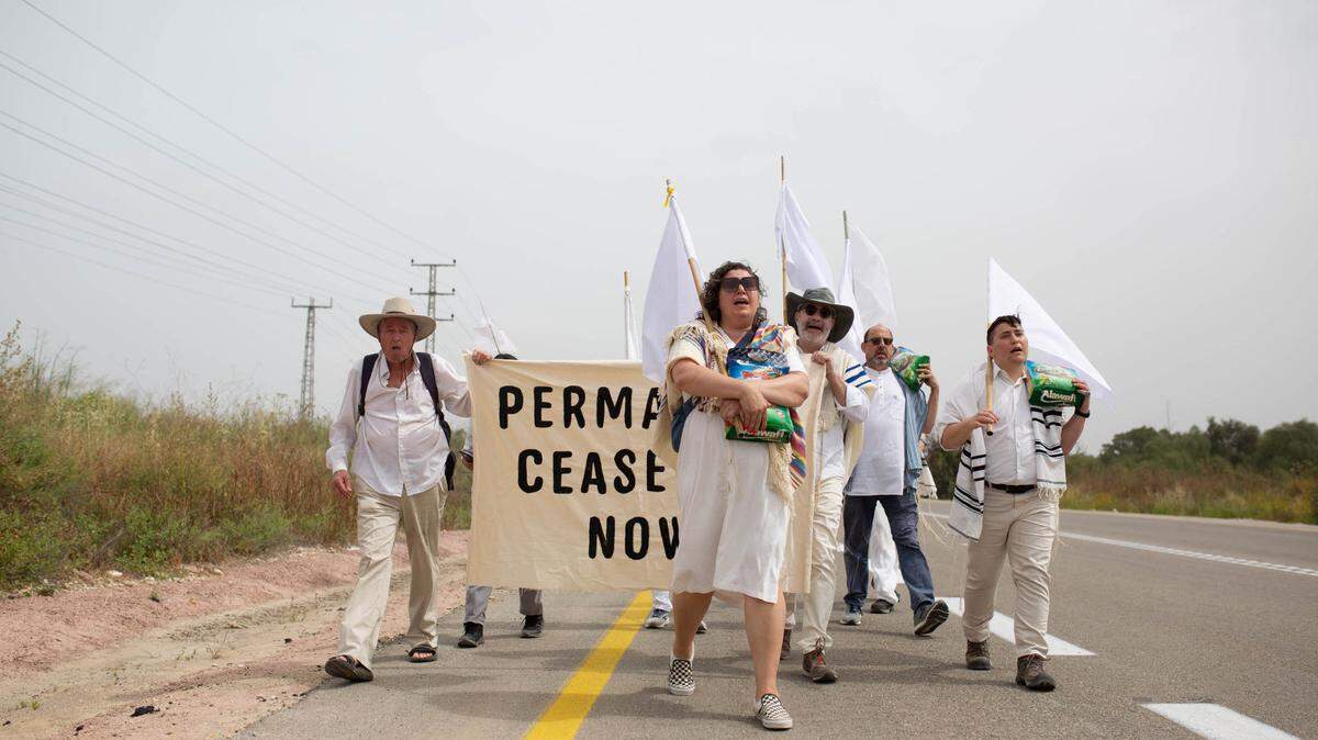 Noah Rubin-Blose, far right, of North Carolina walks toward the Erez crossing in northern Gaza with a group of rabbis and peace activists. They were attempting to deliver food aid to the people of Gaza on April 26, 2024 when they were turned back by police.