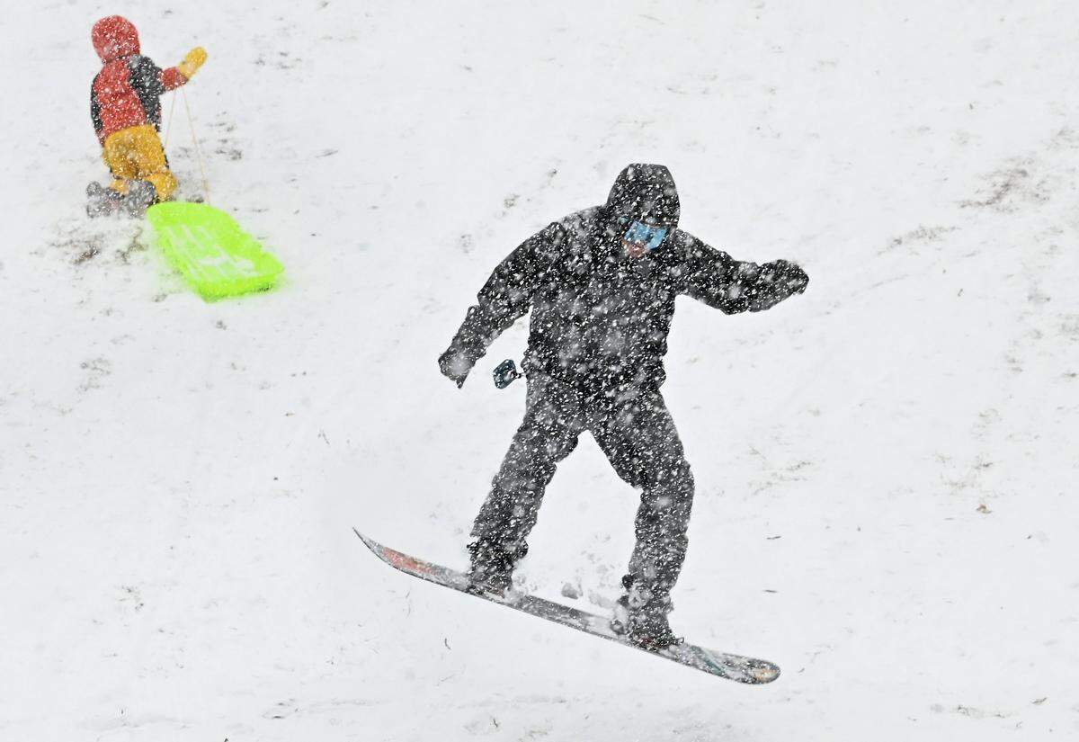 Enjoying the fresh snow, Dominic Sansottaon catches air off a hill at Veterans Park in Charlotte, NC on Saturday, January 31, 2026.