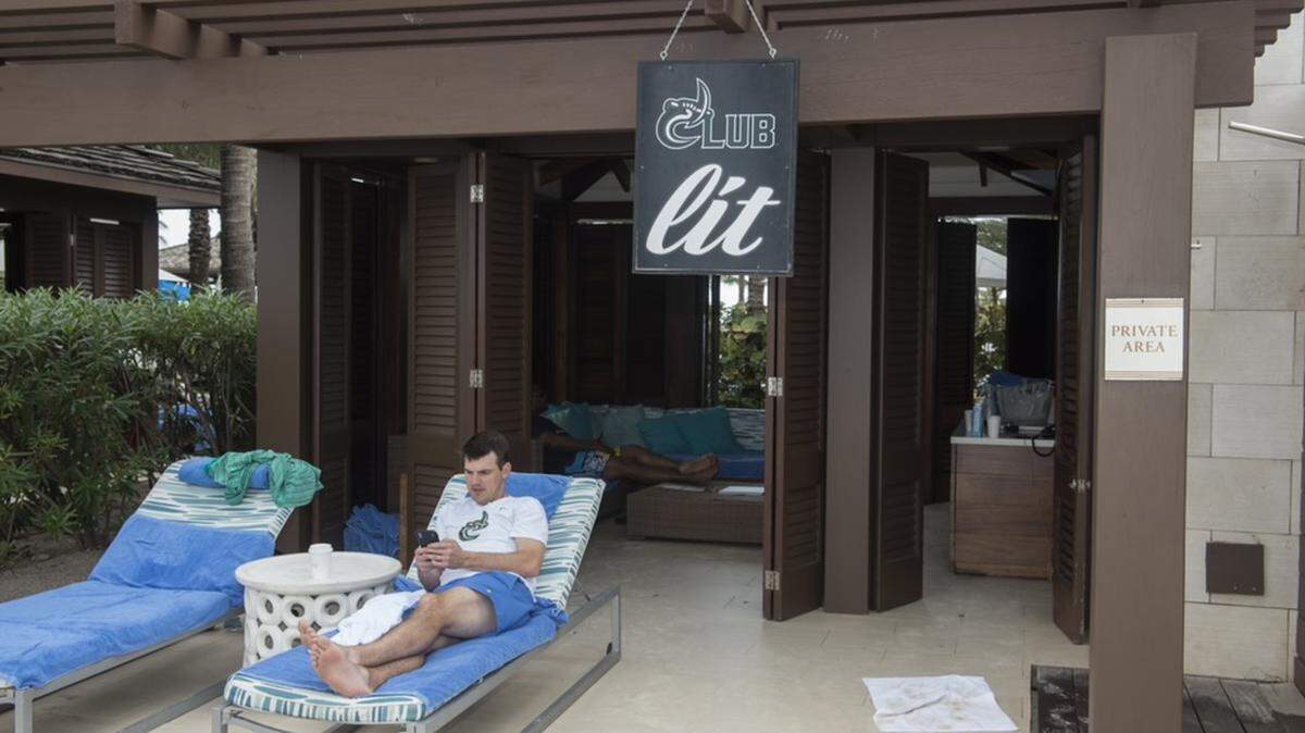 Charlotte 49ers coach Will Healy directed his program’s national signing day activities from a cabana at the Atlantis resort in the Bahamas. CHARLOTTE ATHLETICS