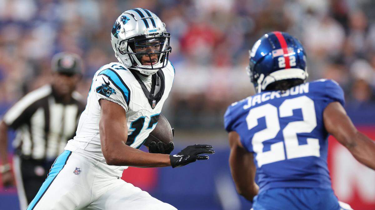Aug 18, 2023; East Rutherford, New Jersey, USA; Carolina Panthers wide receiver DJ Chark Jr. (17) gains yards after catch as New York Giants cornerback Adoree’ Jackson (22) pursues during the first half at MetLife Stadium. Mandatory Credit: Vincent Carchietta-USA TODAY Sports