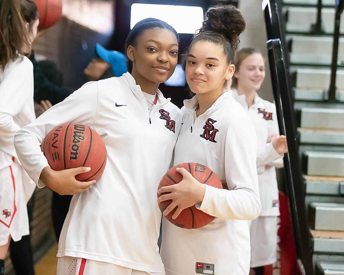 South Meck’s Shariah Gaddy (left) and Senali Moss (right) get ready to take the court in their Friday night game against Ardrey Kell.
