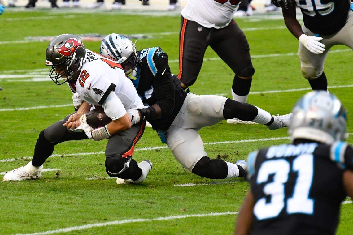 Carolina Panthers defensive end Brian Burns (53) sacks Tom Brady in 2020.