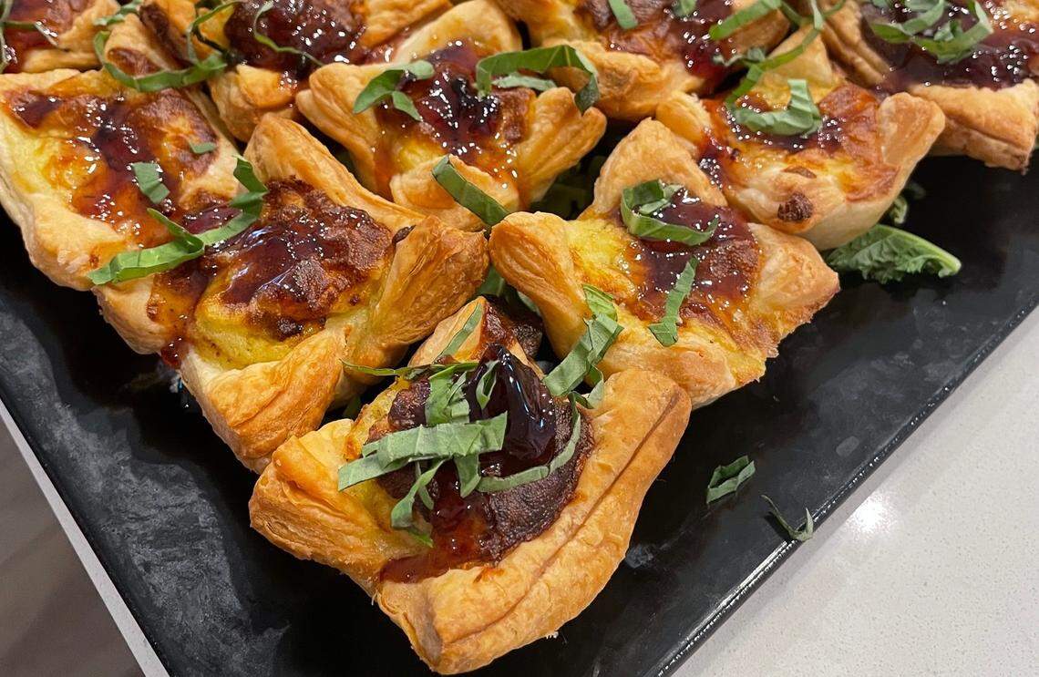 Goat cheese tartlets with roasted grape jam.