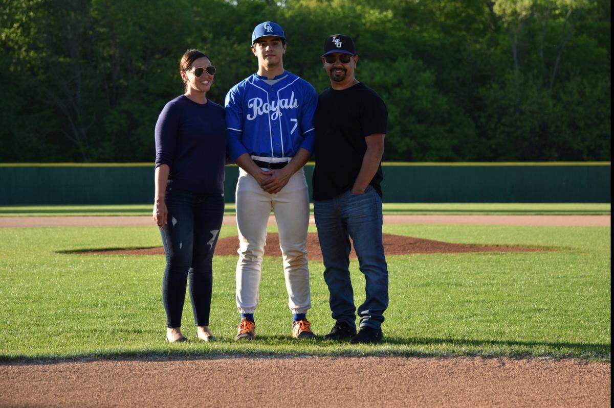Ray Torres, with his parents Gloria and Ray Sr., on “Senior Night” with the Carolina Royals.