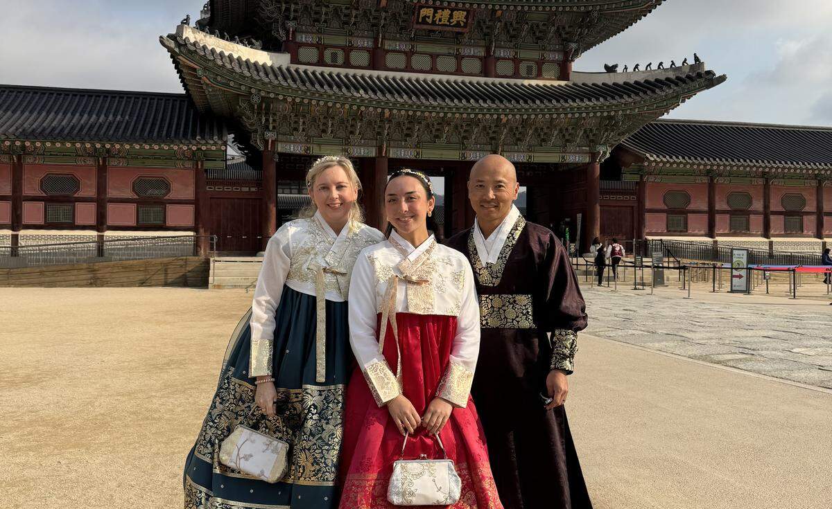 Théoden Janes with his wife Amanda and their daughter Joie, photographed wearing traditional hanboks outside Gyeongbokgung Palace in Seoul last month.