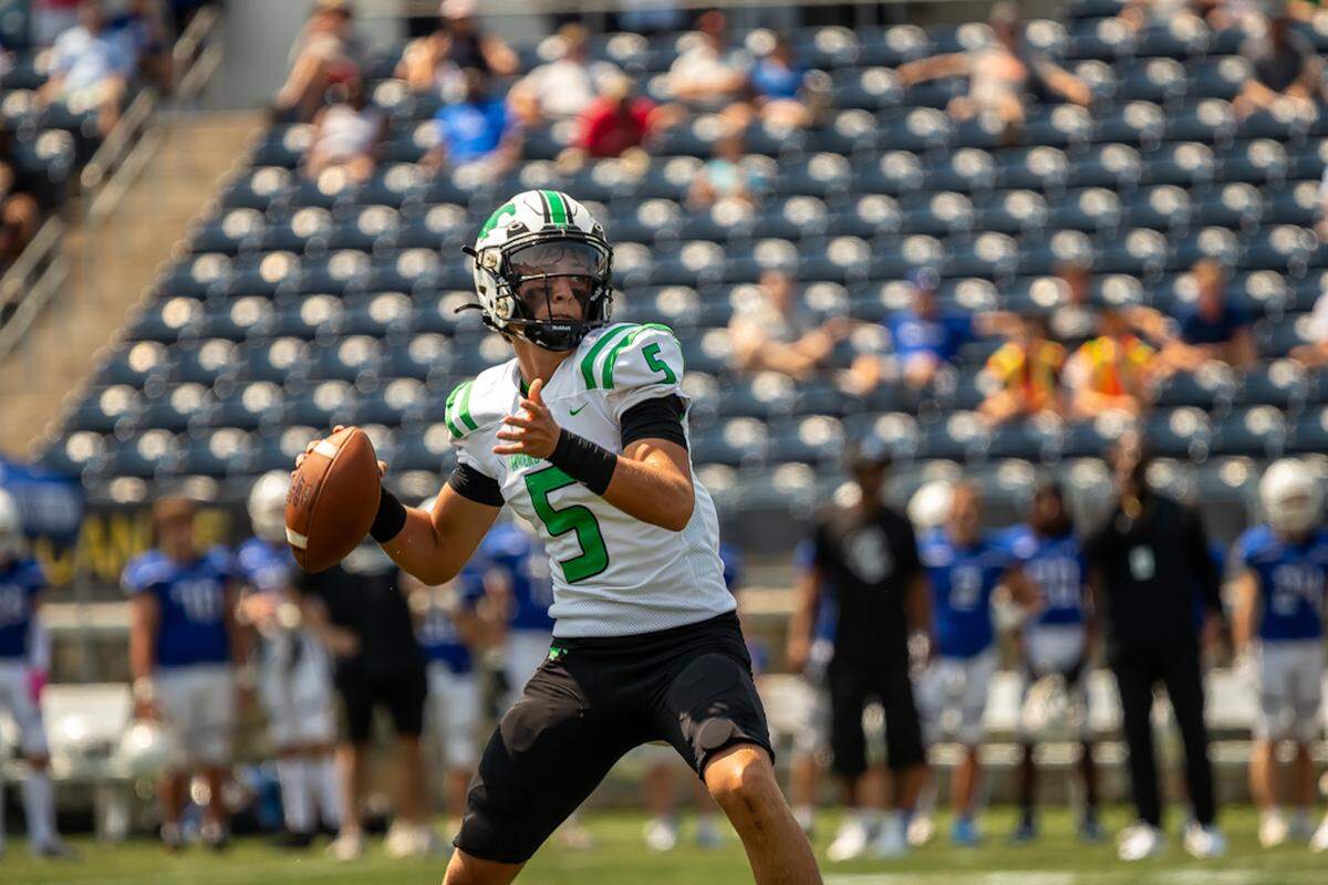 Myers Park quarterback Wendell Thompson looks for an open player down the field