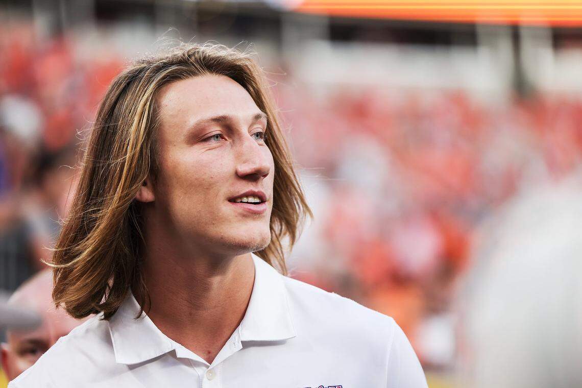 Former Clemson QB Trevor Lawrence walks across the field before the Duke’s Mayo Classic between No. 3 Clemson and No. 5 Georgia at Bank of America Stadium in Charlotte Saturday. Lawrence had the week off but will start for Jacksonville in Week 1 Sept. 12th as a rookie.
