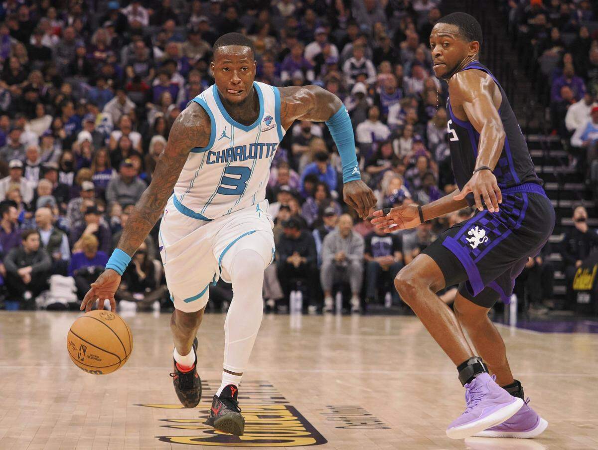 Charlotte Hornets guard Terry Rozier (3) controls the ball against Sacramento Kings guard De'Aaron Fox (5) during the fourth quarter at Golden 1 Center.