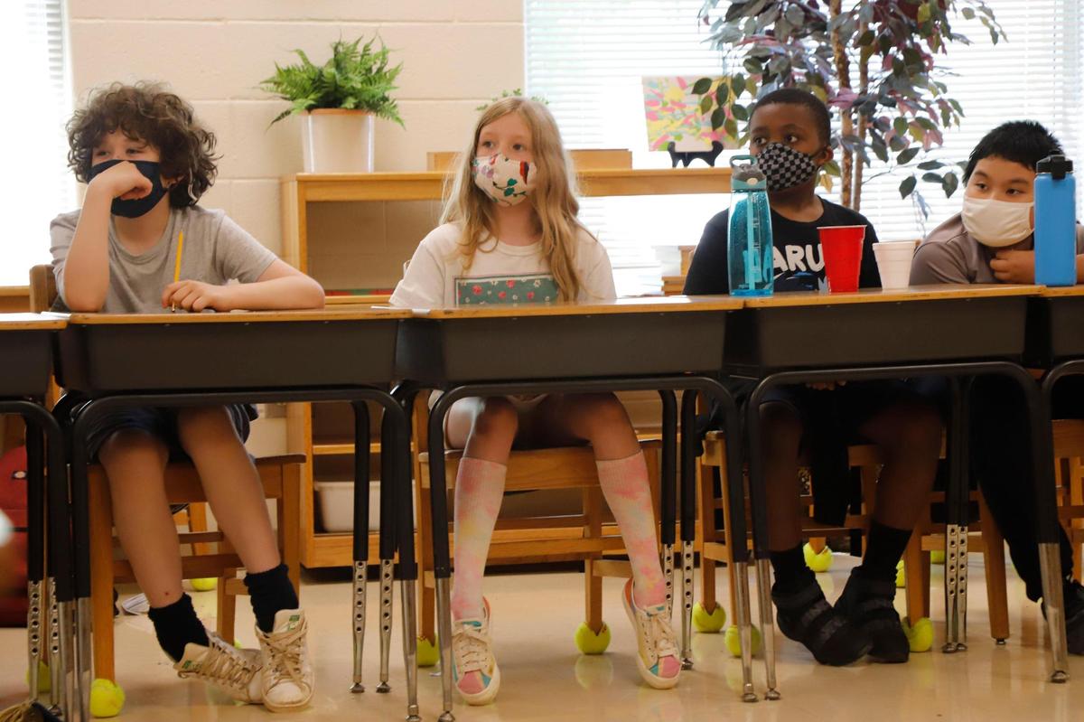 Fifth grade students sit in class during Camp CMS at Highland Mill Montessori in June 2021.