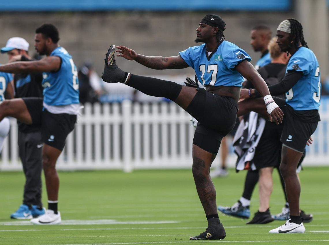 Panthers wide receiver Xavier Legette, center, stretches during day one of training camp practice in Charlotte, NC on Wednesday, July 24, 2024.