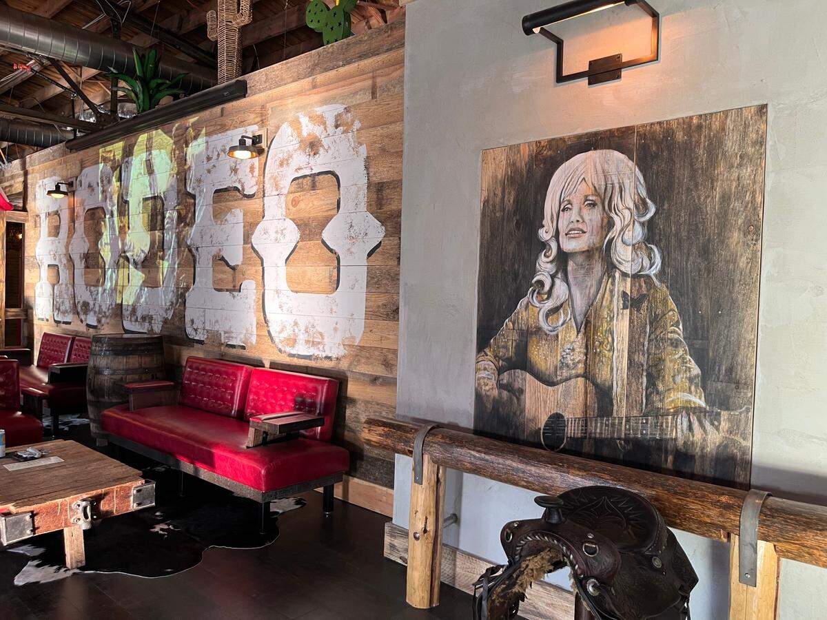 Country music icon Dolly Parton makes an appearance in the decor at Nickyo’s Rodeo.