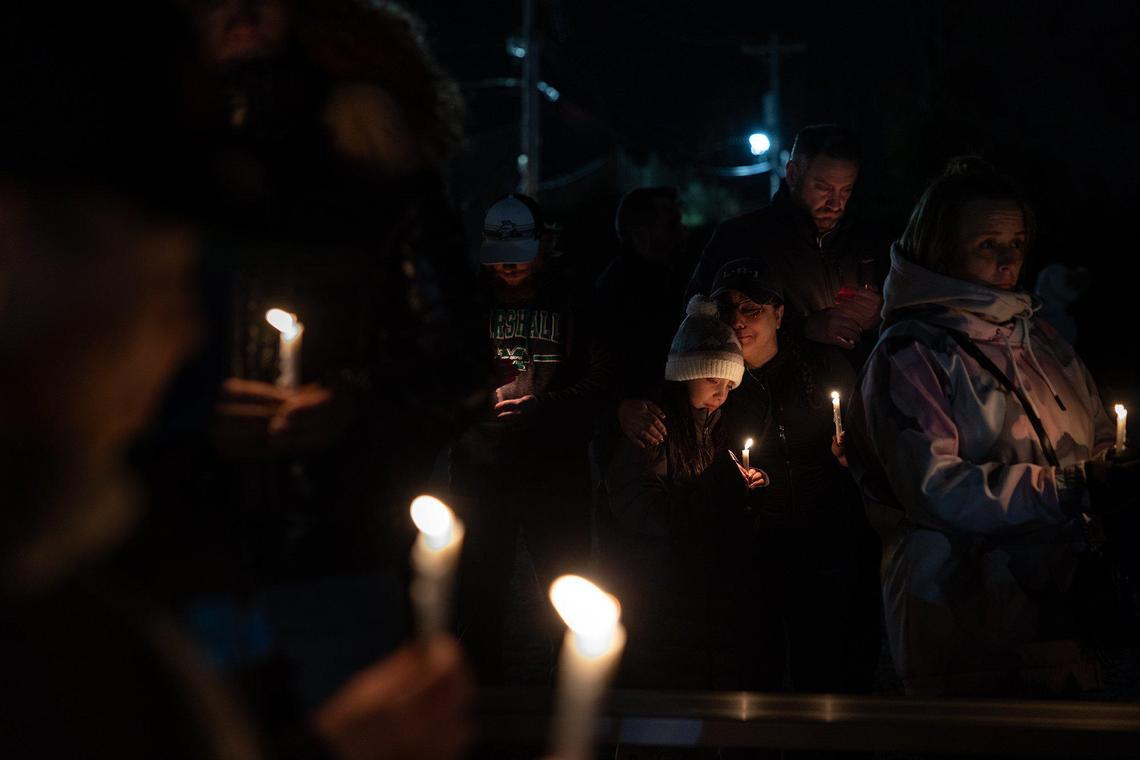 The community gathers for a candlelight vigil for Madalina Cojocari, 11, in Cornelius, N.C., on Tuesday, December 20, 2022. Madalina Cojocari wasn’t reported missing until Dec. 15 by her mother and step-father, Diana Cojocari, 35, and Christopher Palmiter, 60, who have both been arrested for failure to report the disappearance of a child to law enforcement.