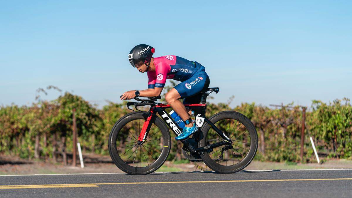 Théoden Janes pedals along the Ironman California bike course on Oct. 19.