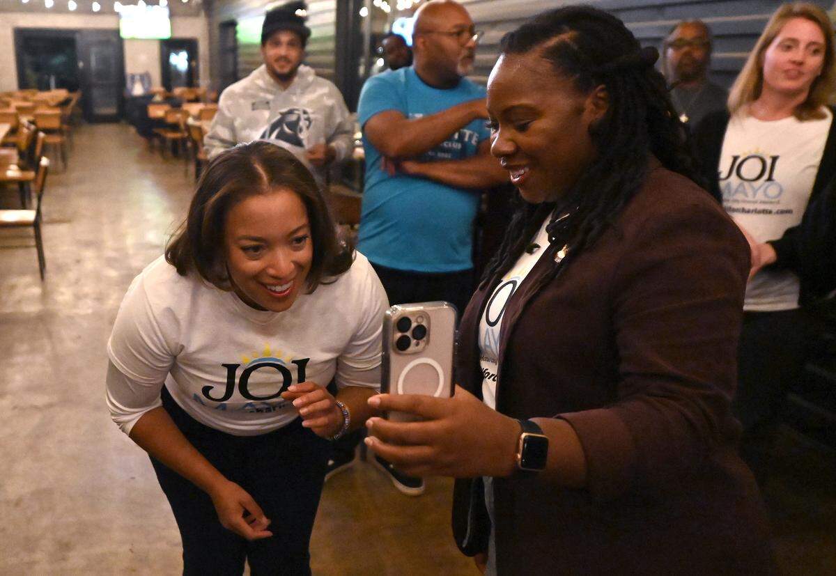 District 3 Charlotte City Council Representative candidate Joi Mayo, left, talks with her mother following her victory over incumbent Tiawana Brown on Tuesday, September 9, 2025 at Brewers at Yancey in Charlotte.