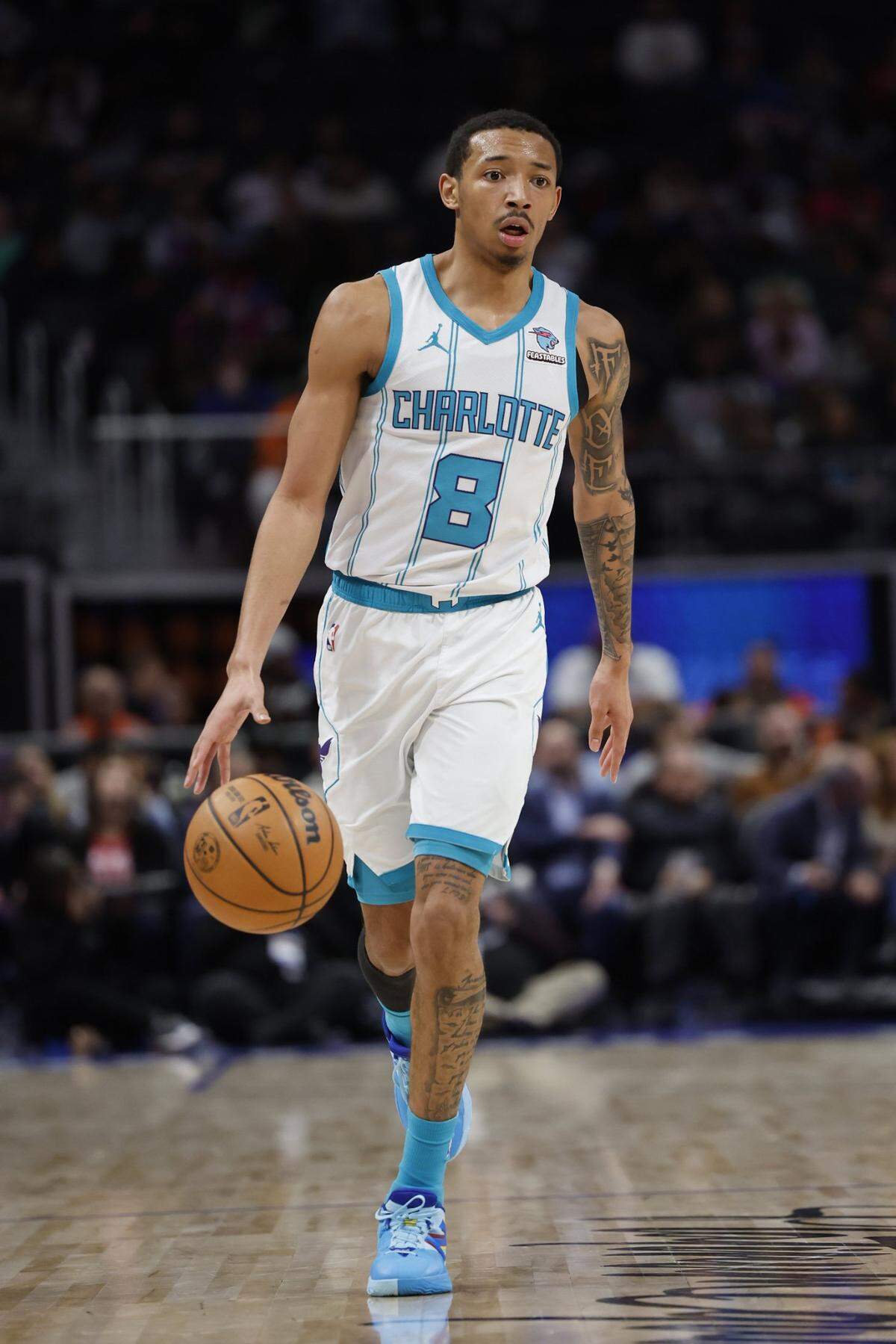 Charlotte Hornets guard Nick Smith Jr. (8) dribbles in the second half against the Detroit Pistons at Little Caesars Arena.